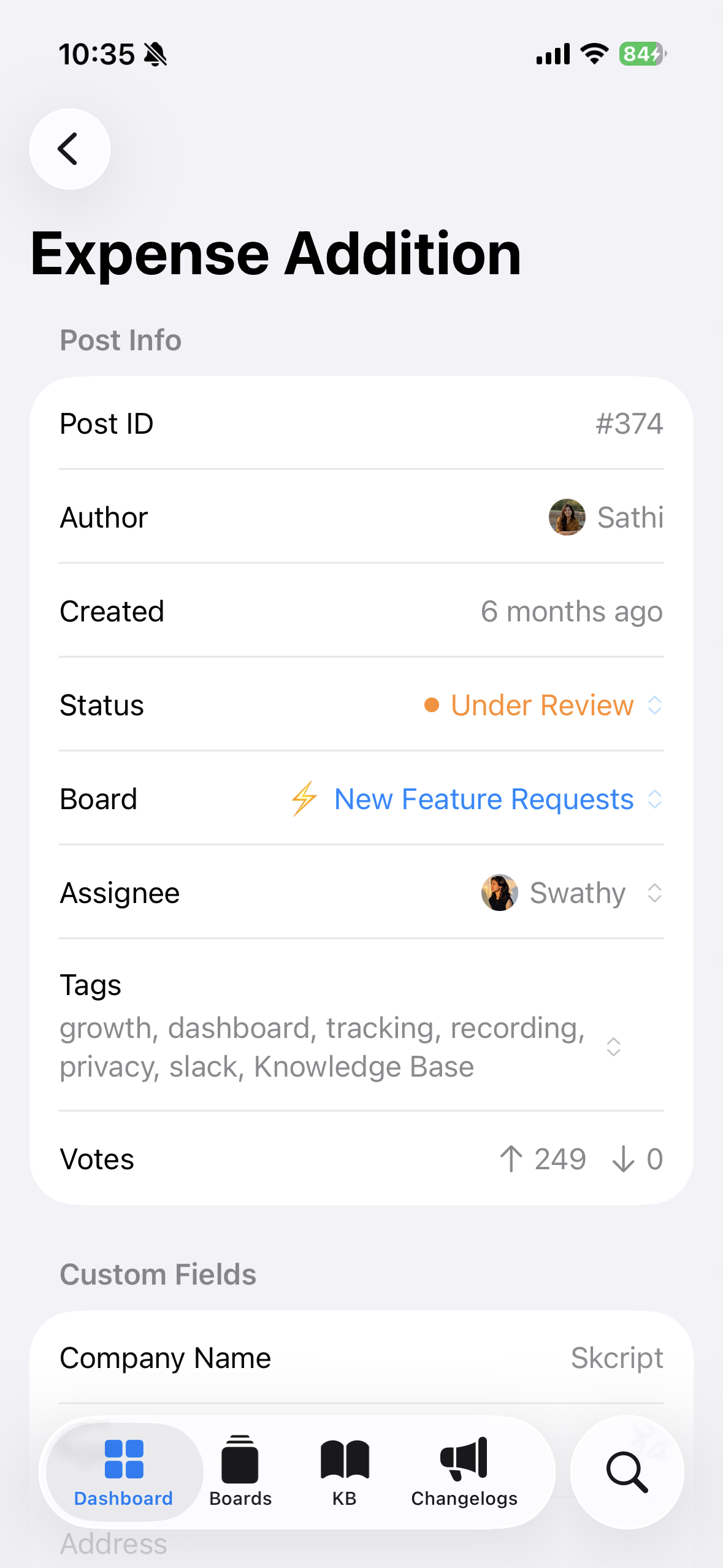 FeatureOS iOS app post detail view showing status, board, assignee, tags, and votes